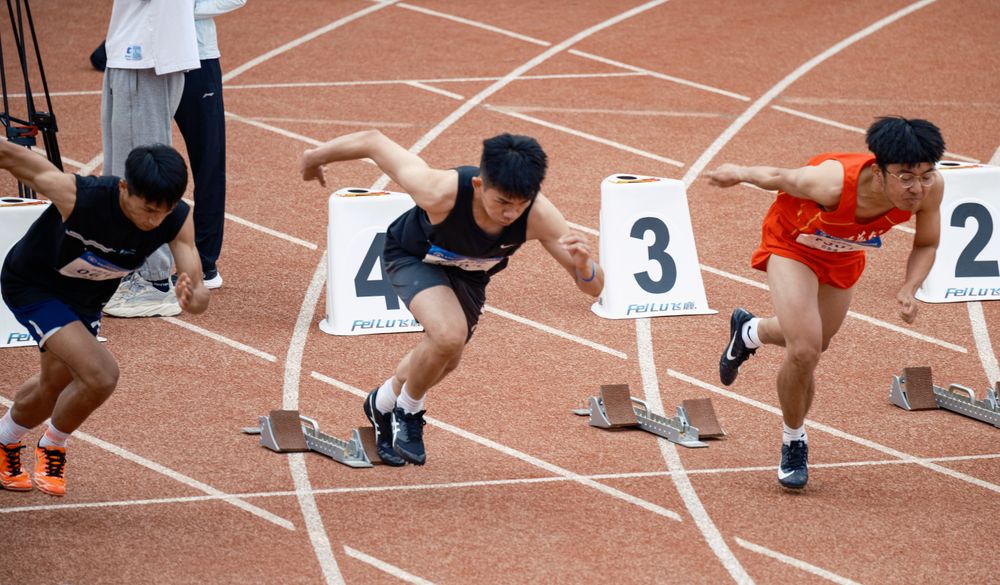 Sprinters at the start of a running track