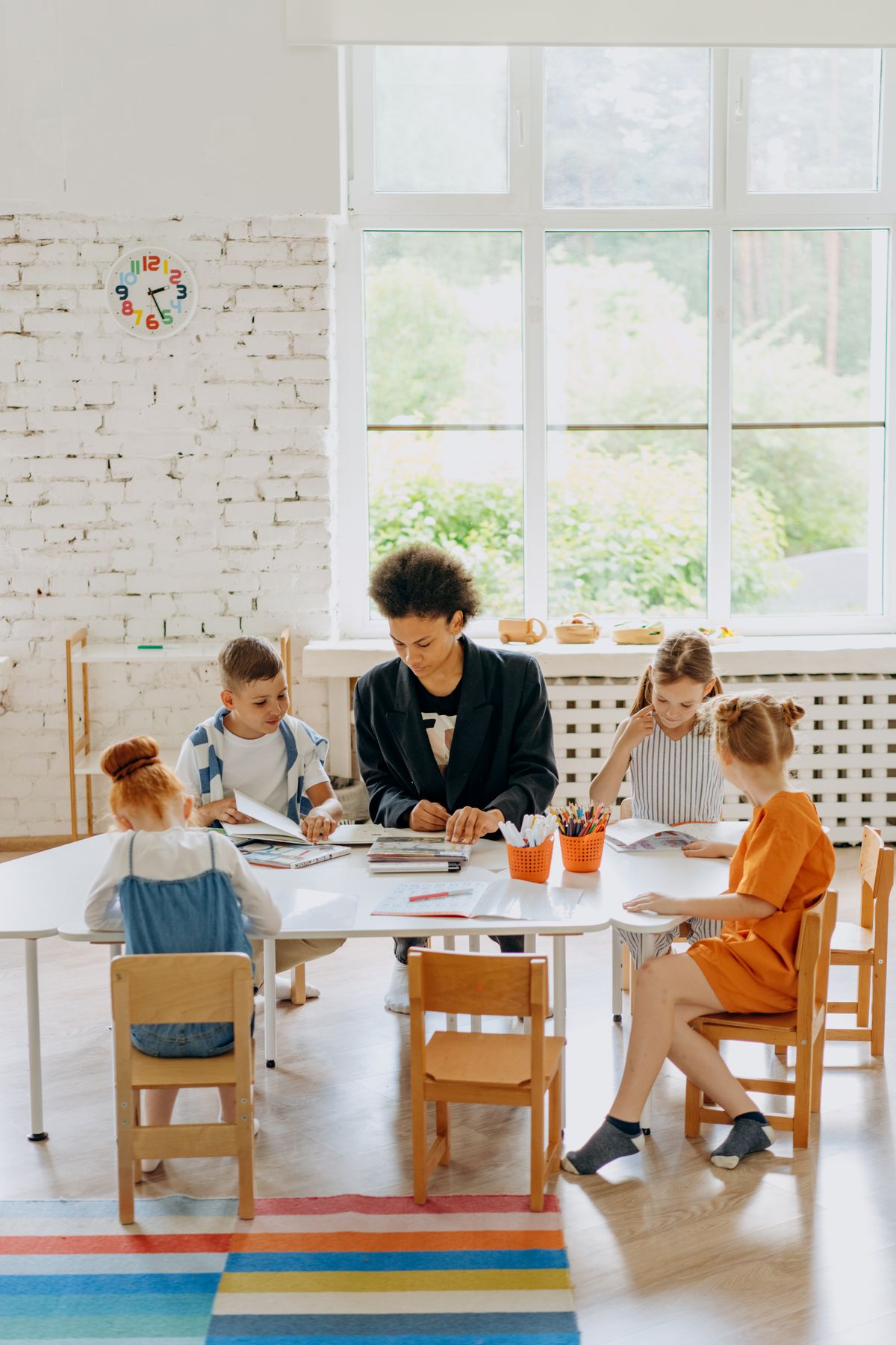 Older students working with a teacher in class