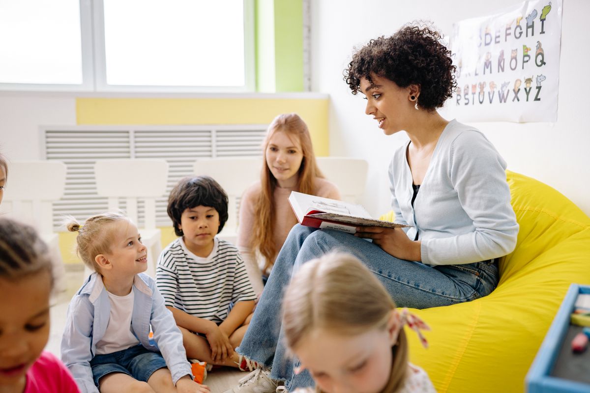 Young children playing and moving in a bright activity room